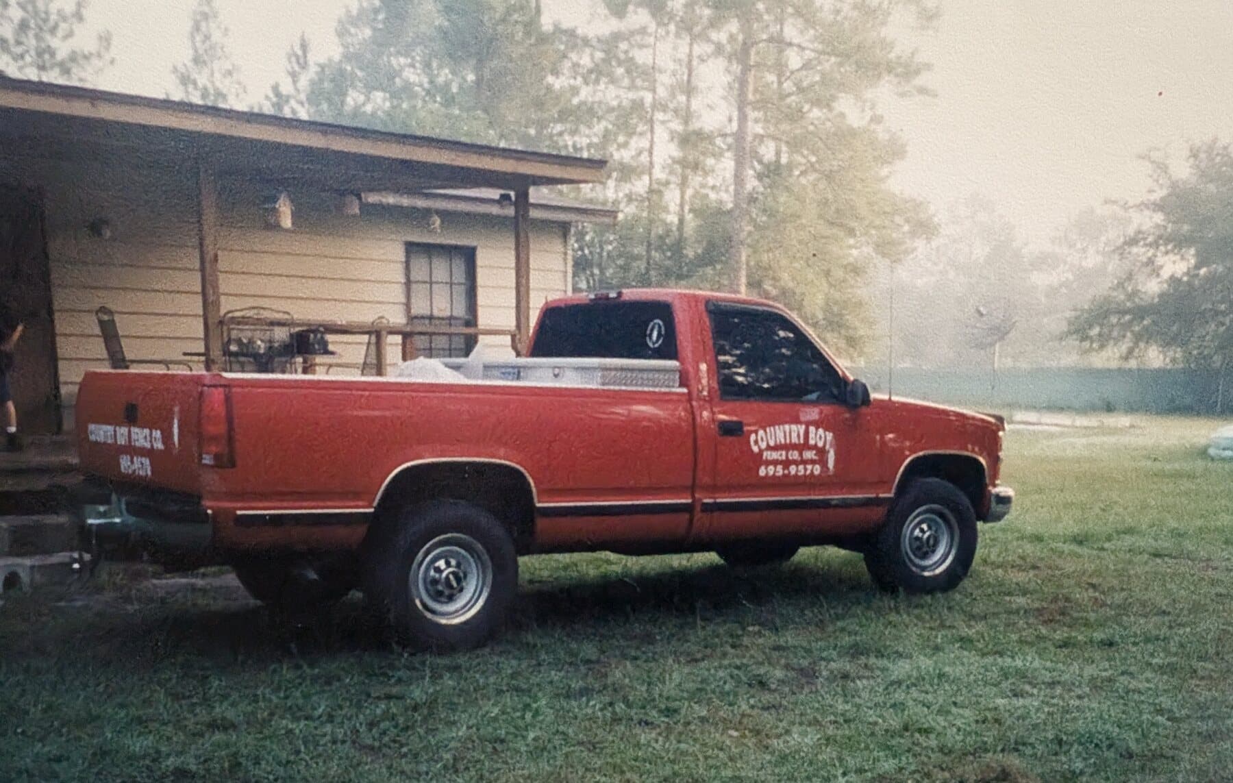 An early Country Boy Fence red pickup at the west-side yard.